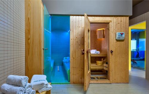 a bathroom with a shower and a toilet in it at Sirios Village Hotel & Bungalows - All Inclusive in Kato Daratso