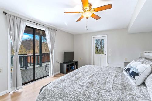 a bedroom with a bed and a ceiling fan at Making Memories in Blairsville