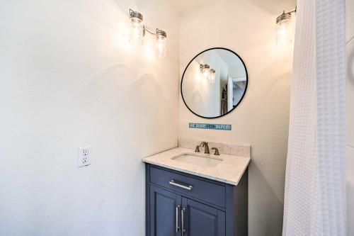 a bathroom with a sink and a mirror at Hot Tub, Pool, Dock: 2 Cabins Lakeview Grand Lake in Grove