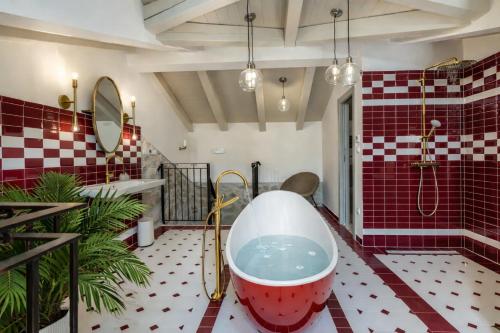 a large bathroom with a tub with a fish in it at Deluxe Nature Resort Galovi Dvori in Rab