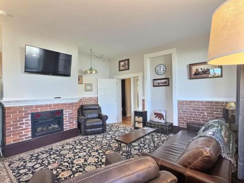 a living room with a couch and a fireplace at Papa's Place - blocks from downtown in Leadville