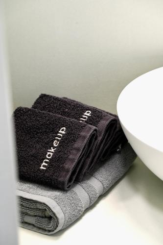 a pair of gloves sitting on top of a sink at Sto Faro - Green in Kithnos