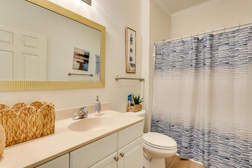 a bathroom with a sink and a toilet and a shower at Pool Access! Recently Updated Coastal Retreat in Foley