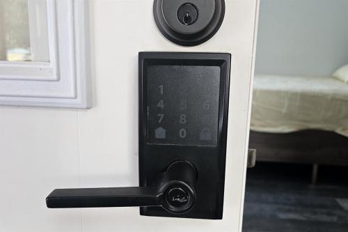 a door lock on a door with a bedroom at Seward Mountain View Cabins #10 in Seward