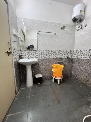 a bathroom with a sink and a mirror at IRCTC Hotel HOSPET in Hospet