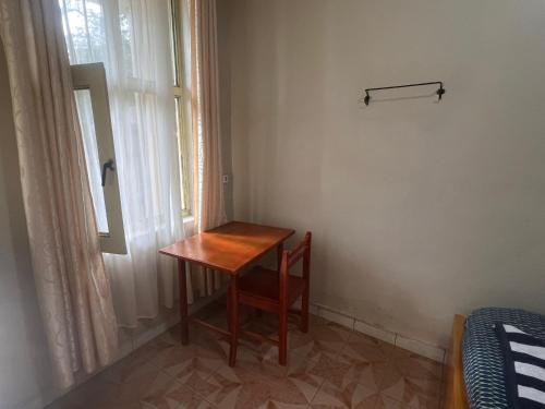 a small table in a room with a window at Zebra guesthouse Hawassa in Āwasa