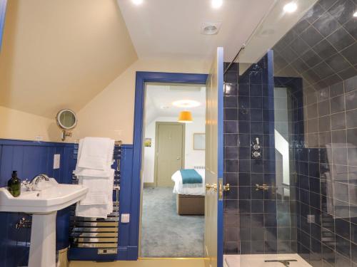 a bathroom with a sink and a shower at The Mandrel in Tain