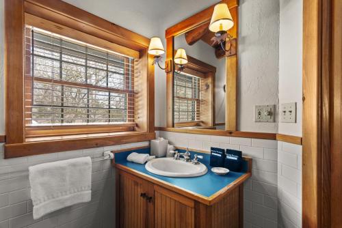 a bathroom with a sink and a mirror at Emerson Resort & Spa in Mount Tremper