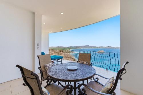a dining room with a table and chairs and the ocean at Wake Up to the Pacific, Concierge Included in Playa Flamingo