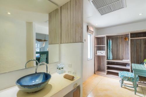 a bathroom with a sink, tub, and counter top at Paradise KohYao - SHA Extra Plus in Ko Yao Noi