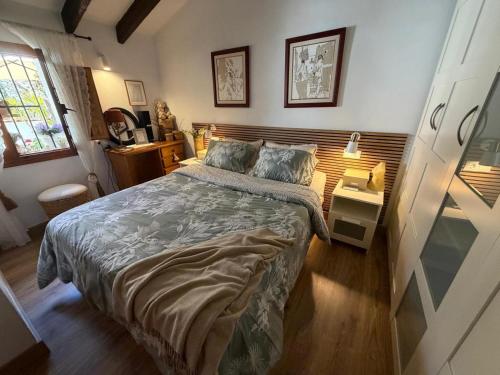 a bedroom with a large bed in a room at Casa Trinidad in Denia