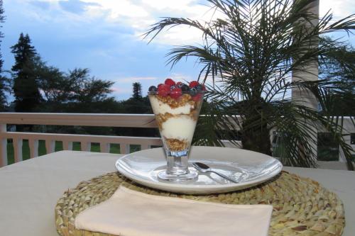 a glass of ice cream on a plate on a table at Southey House in Kloof