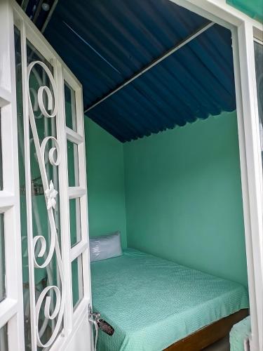 a small room with a bed in a window at cabañas de descanso in Anolaima