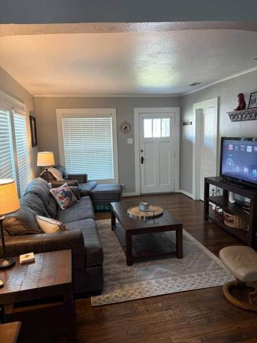 a living room with a couch and a table at The Gates House in Brady