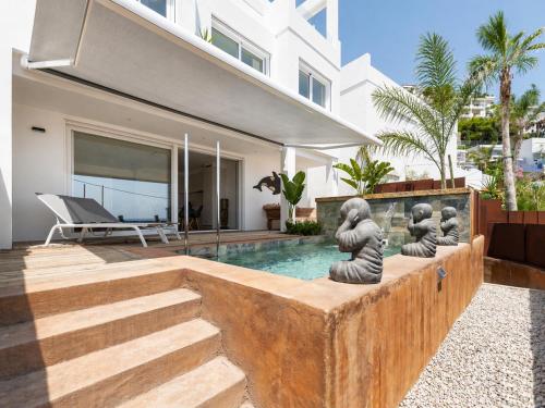 a villa with a swimming pool and a house at Vista Roses Mar - Ancla Mar in Roses