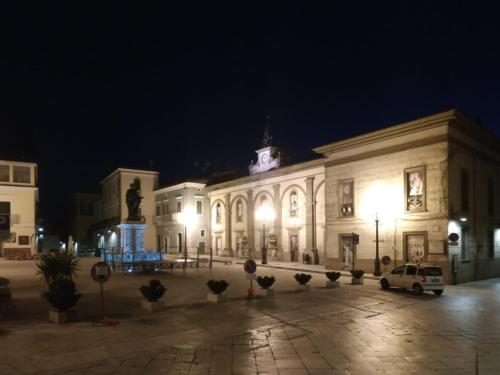 a large white building with lights at night at Bed and Breakfast In Piazza Orazio in Venosa