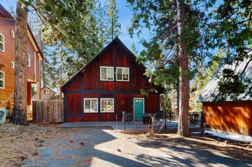 a red barn with a blue door in front of a house at Speckled Tahoe in Kings Beach