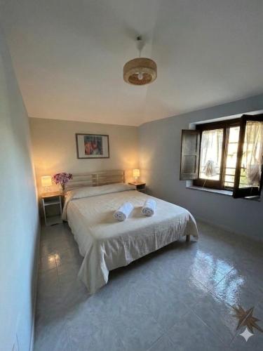 a bedroom with a bed with two towels on it at Domus Anemone B&B in Avellino
