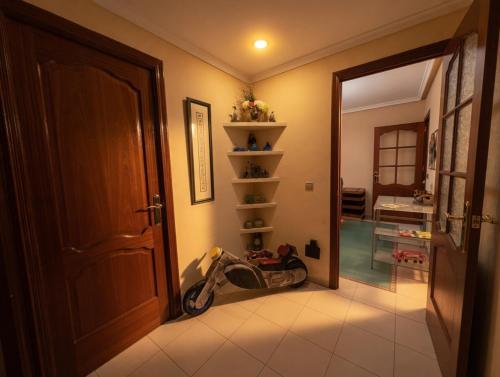 a hallway with a motorcycle parked next to a door at Paseo del mar in Melilla