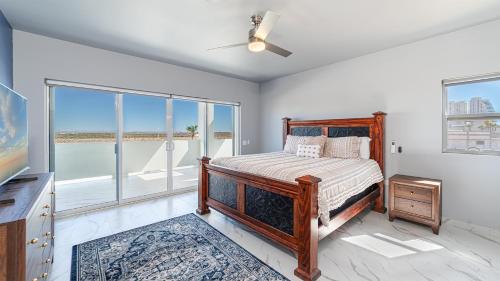 a bedroom with a bed and a view of the ocean at Casa Bonita Encantame Estates in Playa Encanto
