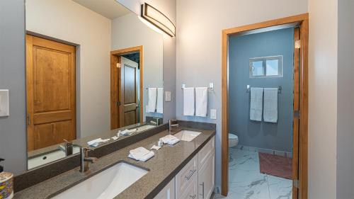 a bathroom with a sink and a large mirror at Casa Bonita Encantame Estates in Playa Encanto