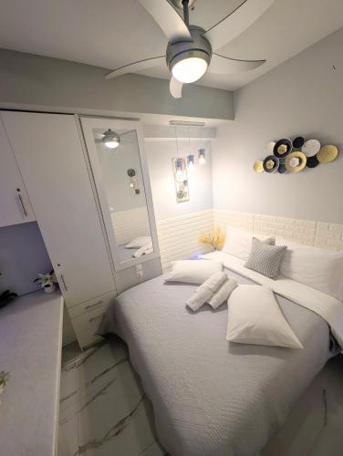a bedroom with a large bed with white pillows at EV Apartment with free parking place in Volos