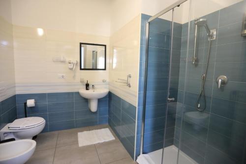 a bathroom with a shower and a toilet and a sink at B&B Le Grazie Tropea in Tropea