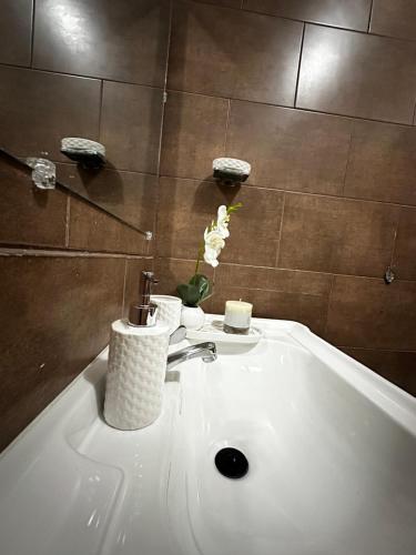 a bathroom with a bath tub with a sink at Casa Privé, Comayagua in Comayagua