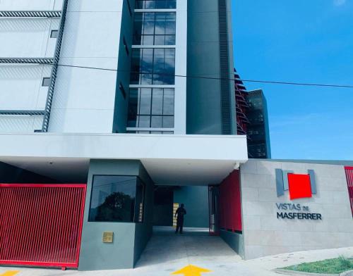 a building with a person standing outside of it at Cielo 404 in San Salvador
