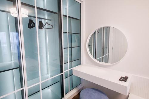 a bathroom with a sink and a mirror at Tilia Lux apartmani in Čačak