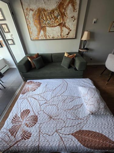 a living room with a bed and a couch at Charming Abode Downtown Vancouver in Vancouver