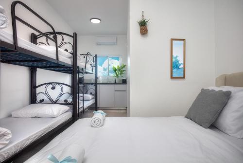 a bedroom with two bunk beds and a mirror at אחוזת בין ההרים צפת in Safed