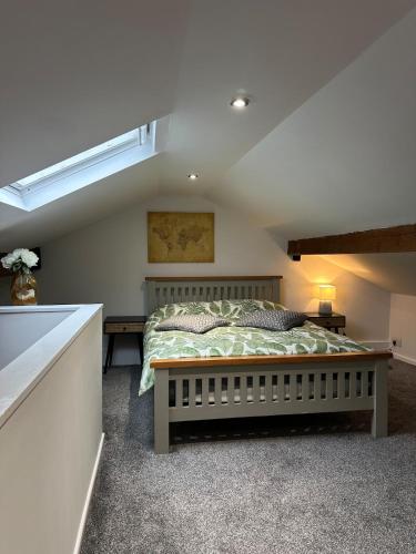 a bedroom with a bed in a room at Snuggle Inn Burnley in Burnley