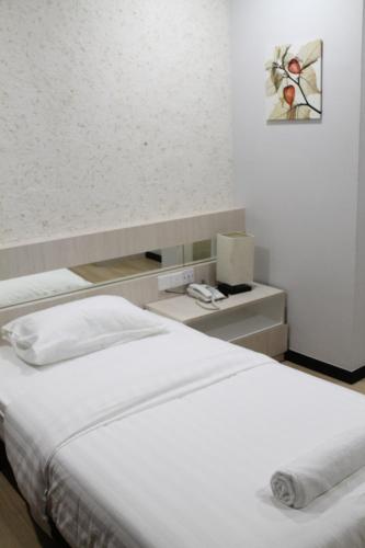 Ένα ή περισσότερα κρεβάτια σε δωμάτιο στο The Velton Inn