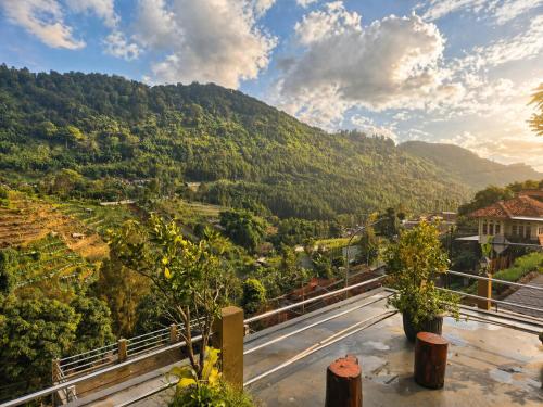 a view of a mountain valley with a road at The Green County Homestay in Panglipurgalin