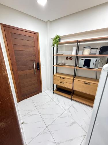 a room with a door and a tiled floor at Centro de Vitoria in Vitória