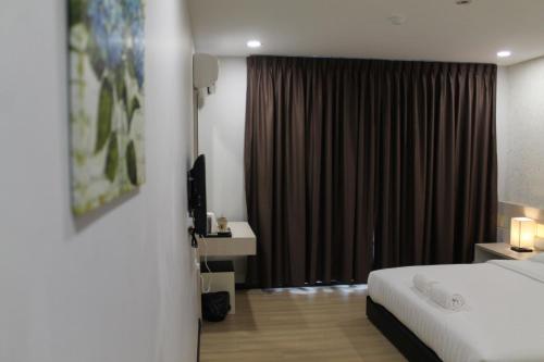 Ένα ή περισσότερα κρεβάτια σε δωμάτιο στο The Velton Inn