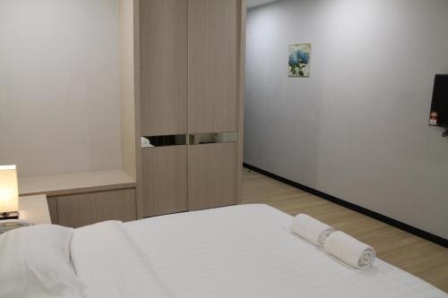 Ένα ή περισσότερα κρεβάτια σε δωμάτιο στο The Velton Inn