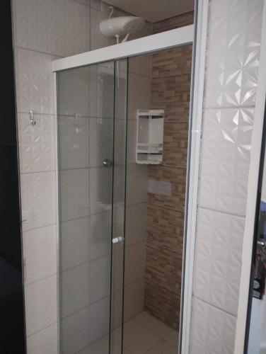 a shower with a glass door in a bathroom at Hotel Real Centro in São Paulo