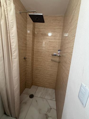 a bathroom with a shower with a glass door at PH 41 Metepec in Toluca