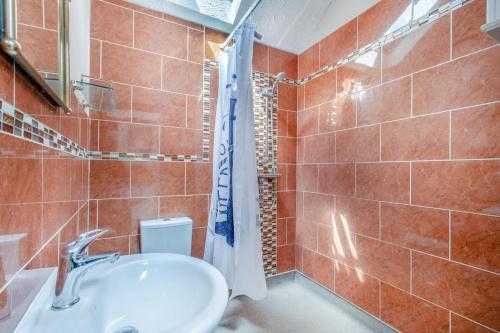 a bathroom with a sink and a shower at 2 Bed in Heacham oc-p29546 in Heacham