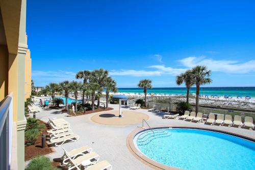 a view of the pool and beach from the balcony of a resort at 3BR Beachfront Huge Balcony 2 Pools Luxury in Fort Walton Beach
