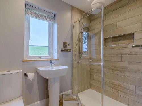 a bathroom with a sink and a shower at 1 Bed in Colne oc-86513 in Rawdon