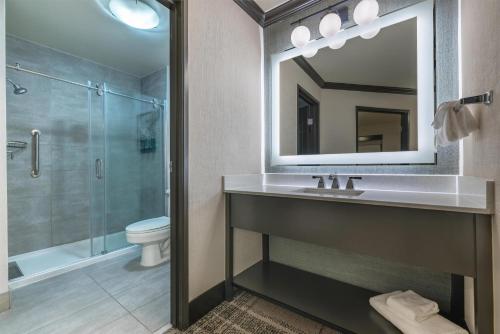 a bathroom with a sink and a shower at The Newberry Hotel Bend, Tapestry Collection by Hilton in Bend