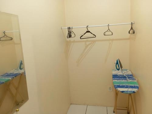 a bathroom with a sink and a mirror at kitnet A in São Luís