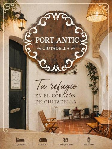 a sign for a restaurant with a table and chairs at Port Antic Ciutadella by My Rooms Hotels TI in Ciutadella