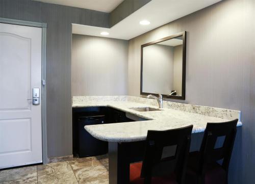 a bathroom with a sink and a mirror at Hampton Inn & Suites Temecula in Temecula