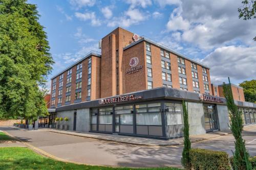 a building with a sign on the front of it at DoubleTree by Hilton London Ealing in London