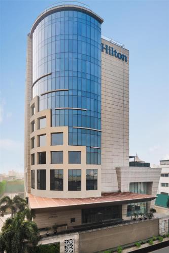 a tall building with a train in front of it at Hilton Jaipur in Jaipur
