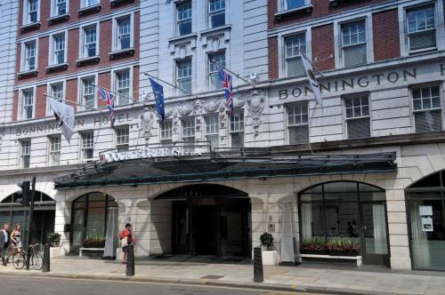 a building with a sign on the front of it at DoubleTree by Hilton London – West End in London